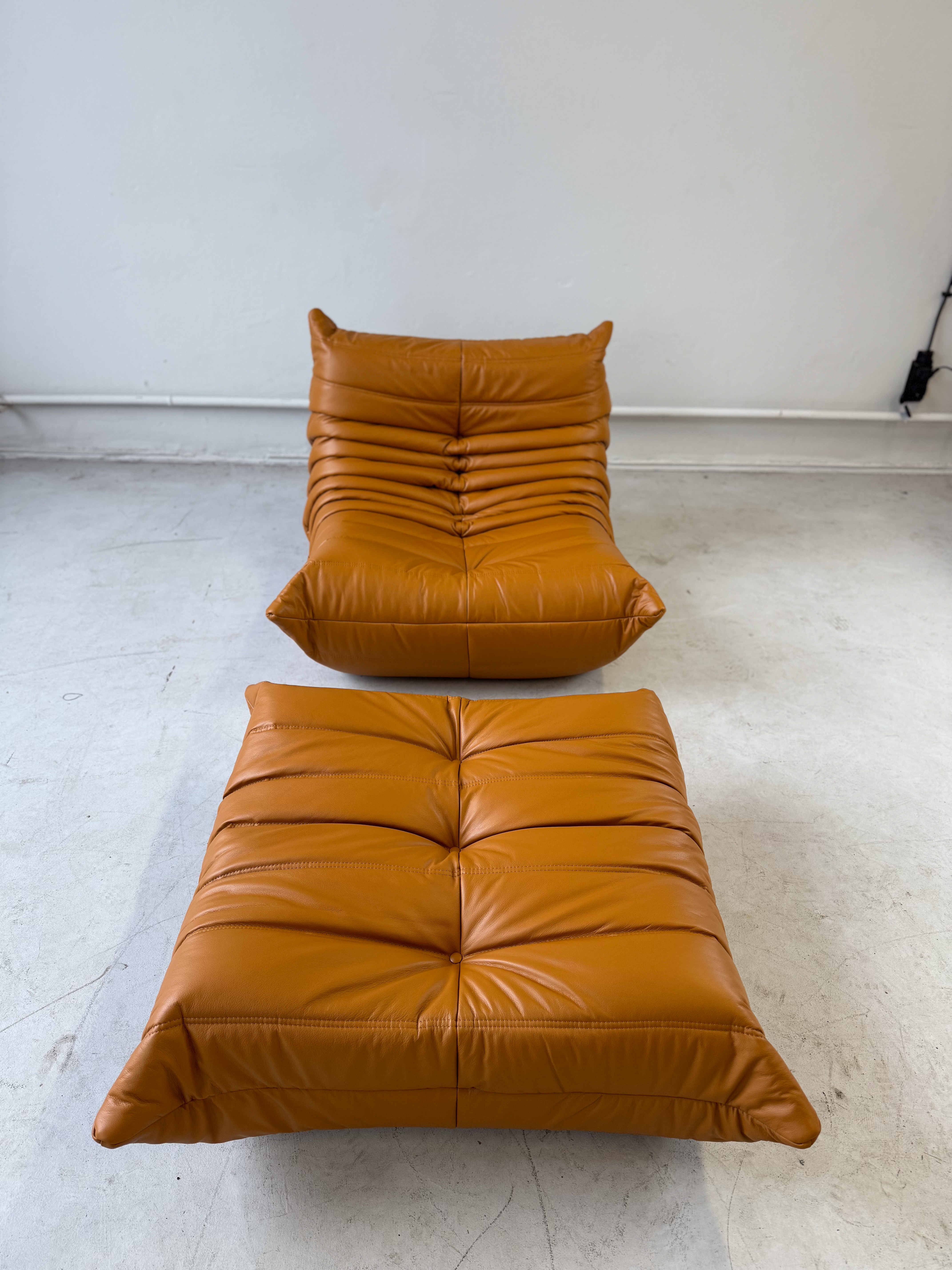 Togo armchair and ottoman set high gloss leather cognac light