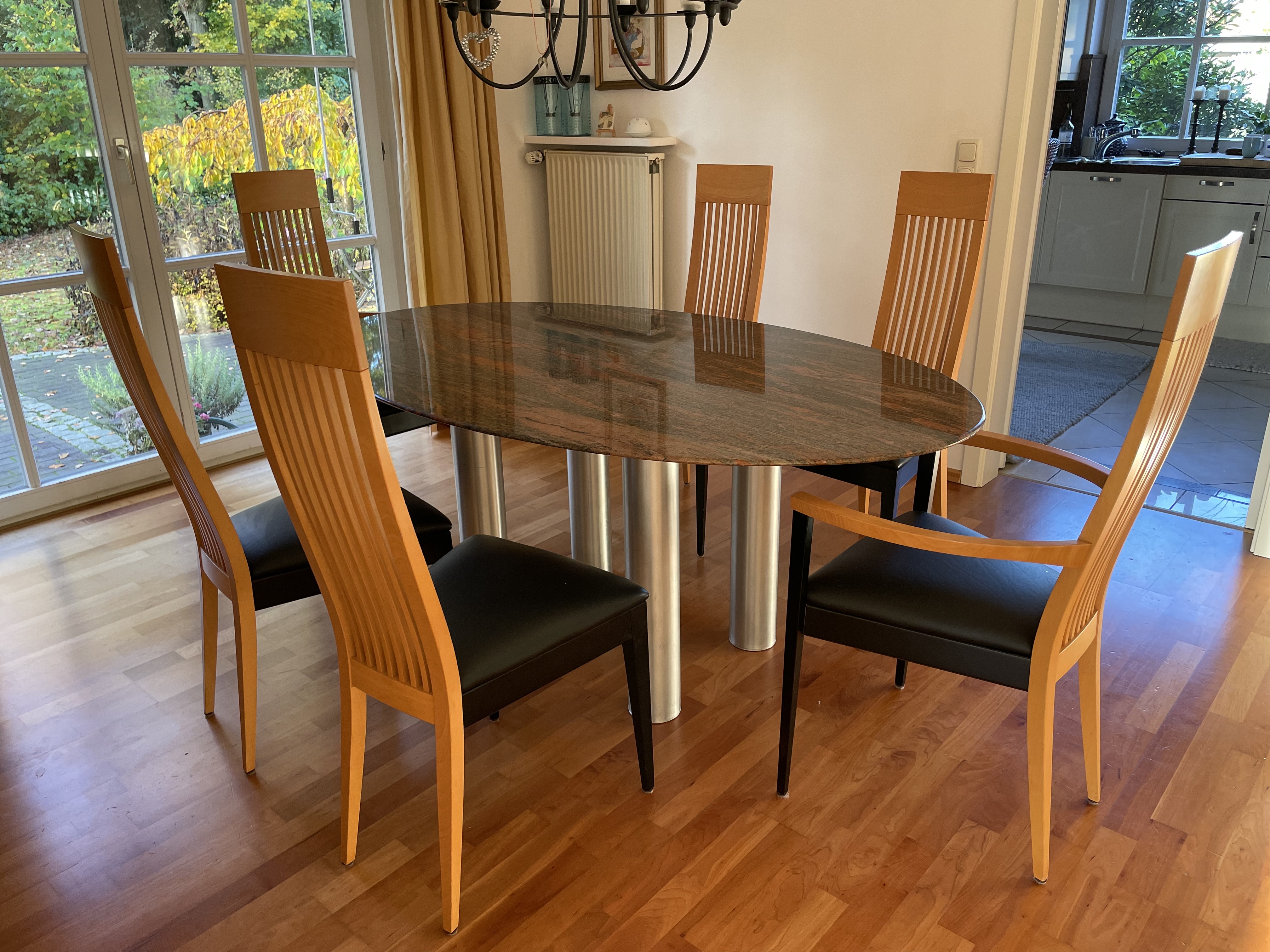 Dining table with oval granite top