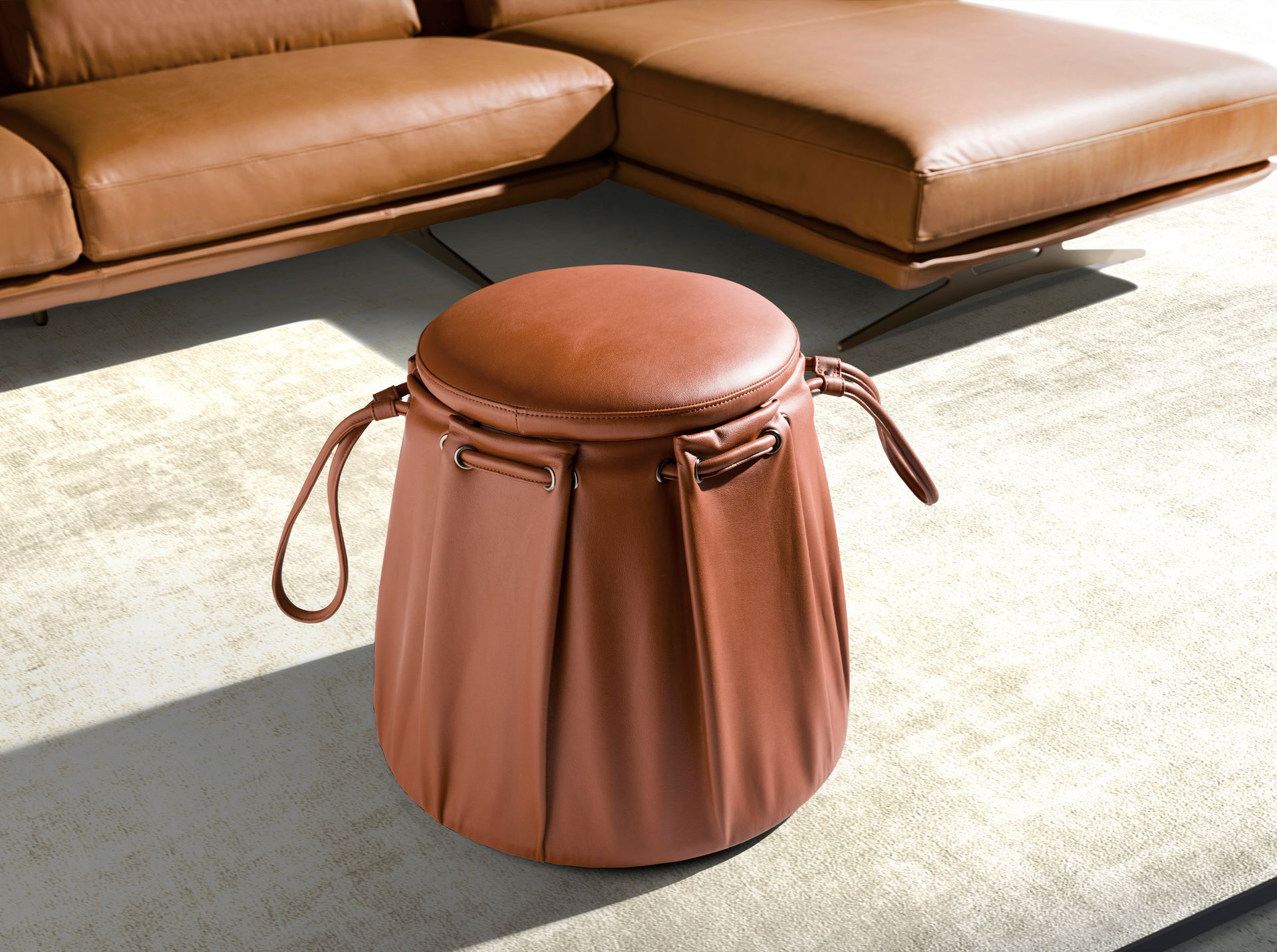 Caldera orange leather pouffe
