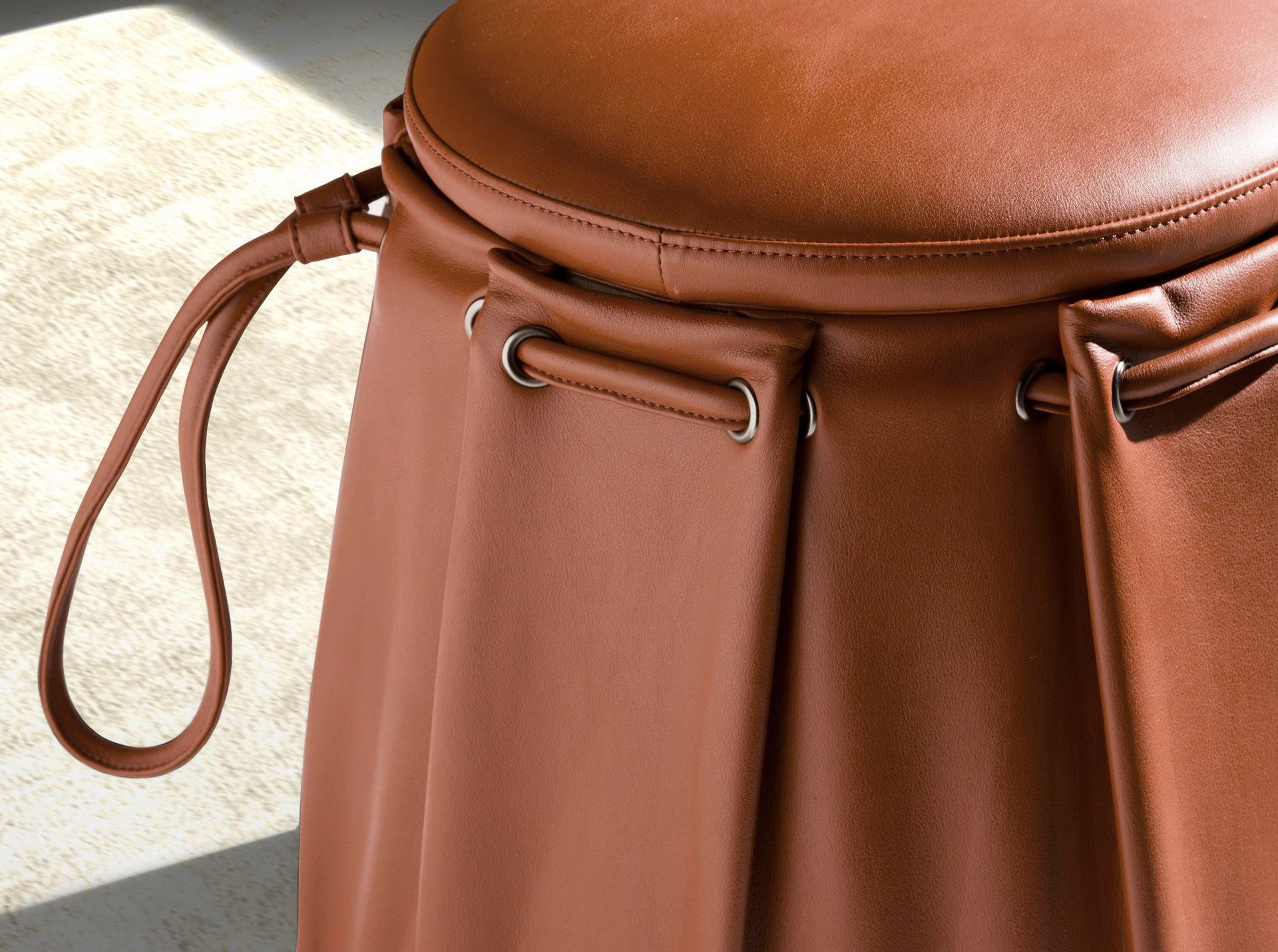 Caldera orange leather pouffe