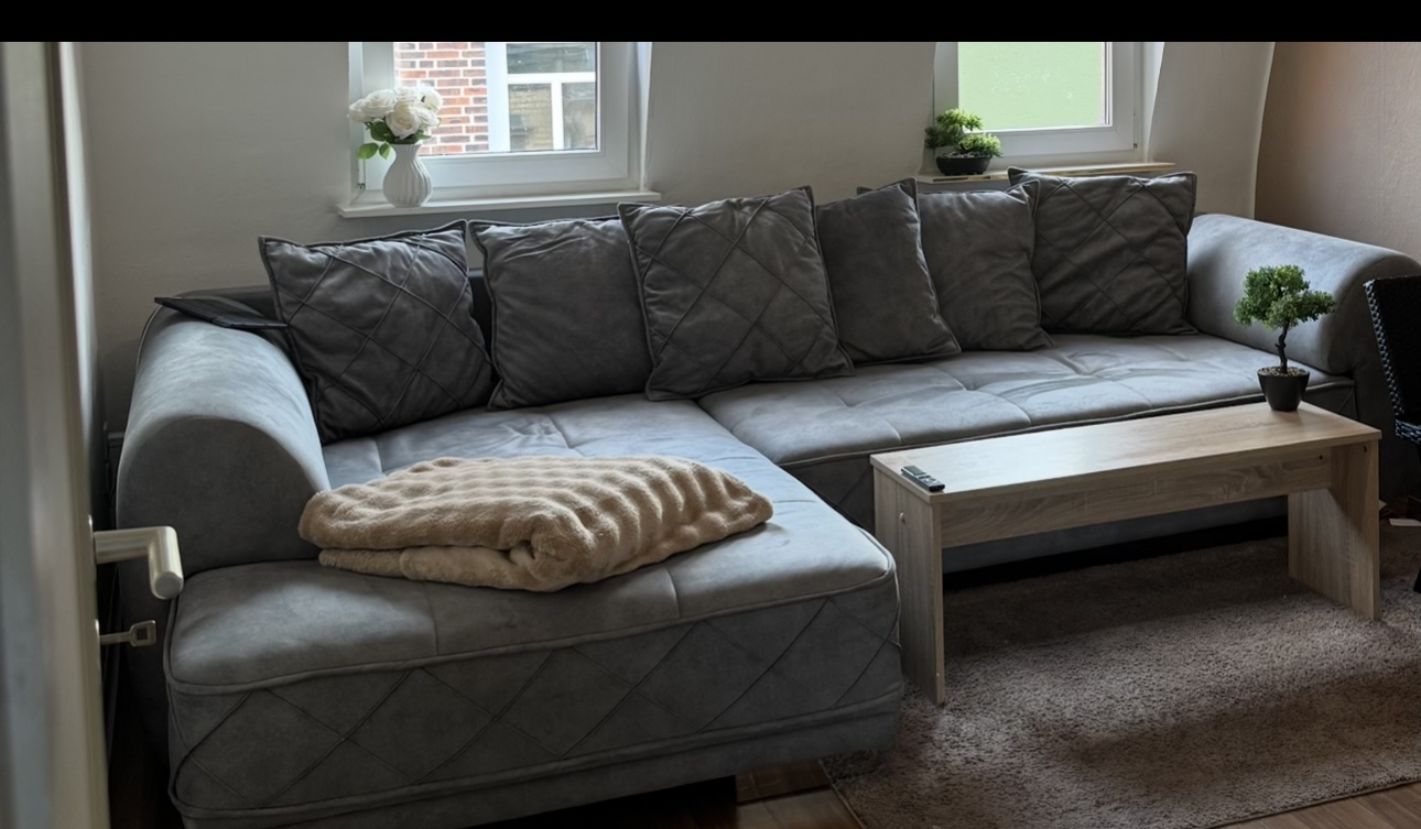 Sentina Ecksofa mit Rückenkissen Grau