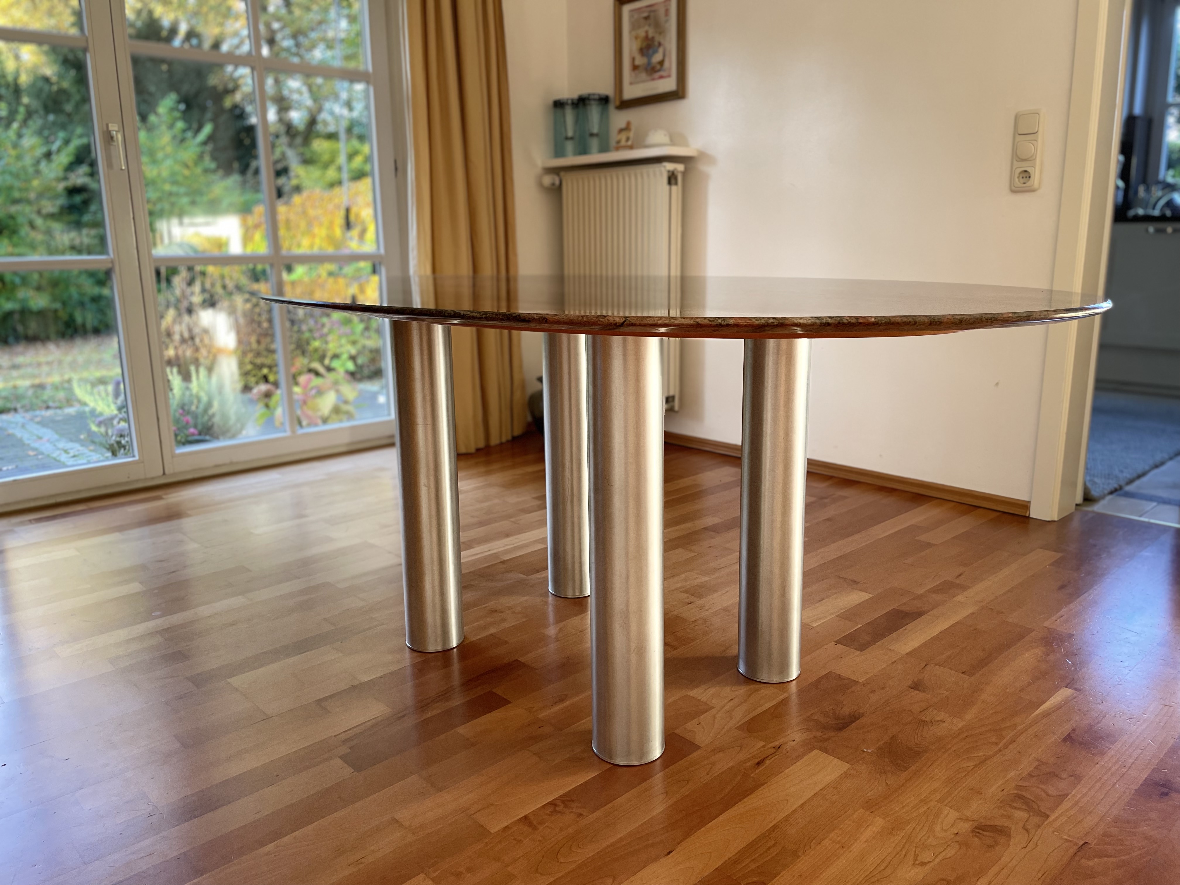 Dining table with oval granite top