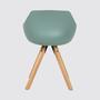 " -> "Mint grey".

    Final check on "Armrest shell chair":
    Armrest (Armlehnen)
    Shell chair (Schalenstuhl)
    With (mit)
    Seat cushion (Sitzkissen)
    Mint grey (Mintgrau)

    This is perfect.

    One last check: "Return only the translated text with no preamble 3