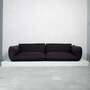 Sofa Jalis von COR Schwarz mit Ton in Ton Muster auf Podest 1